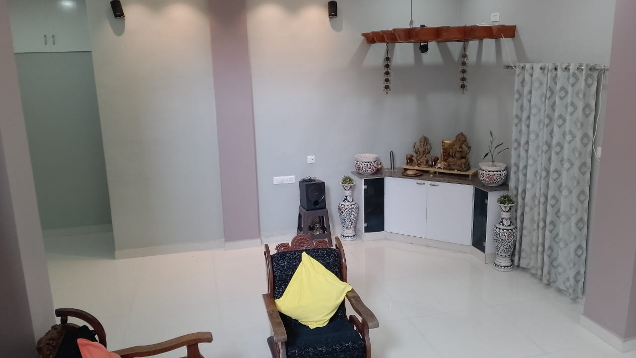 Family lounge with display cabinet and brass decor